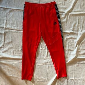 Adidas Red Joggers tapered with pockets and zipper at bottom and on pockets